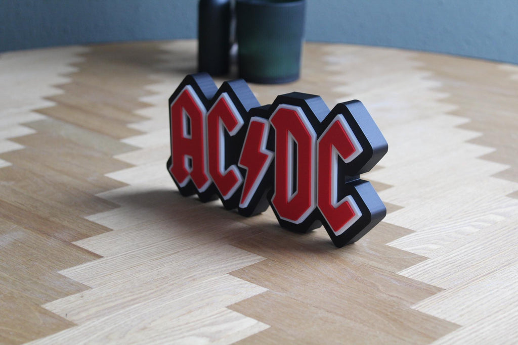 AC/DC Logo 3D Druck | Rock Band Deko | Musik Fanartikel | Geschenk für Rockliebhaber | Rock 'n' Roll Sammlung | Figur Deko Schild