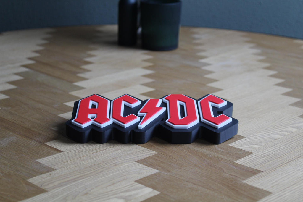 AC/DC Logo 3D Druck | Rock Band Deko | Musik Fanartikel | Geschenk für Rockliebhaber | Rock 'n' Roll Sammlung | Figur Deko Schild